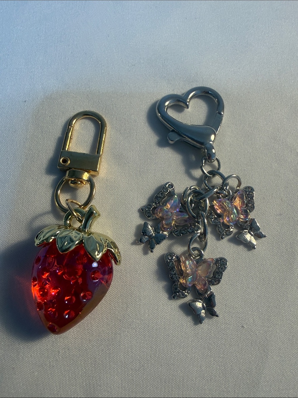 Red Strawberry and Iridescent Butterfly Charm Keychain Set